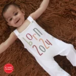 Baby wearing a stylish dungaree suit